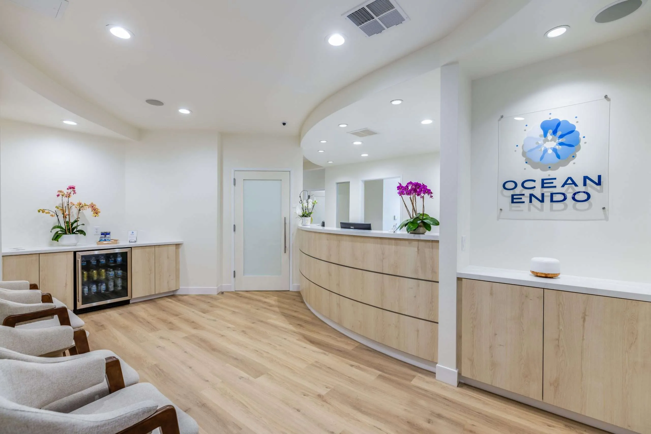 The reception lounge with orchids and the Ocean Endo logo